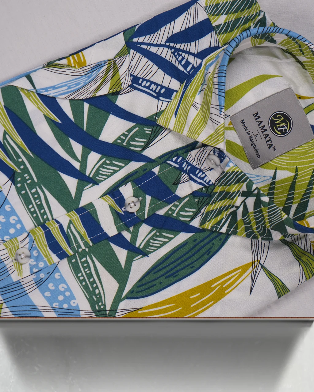 Step out in style with the Mamata Premium Men's Tropical Shirt, the perfect addition to your summer and vacation wardrobe. This vibrant, casual button-down shirt is designed to make a statement with its eye-catching botanical print.